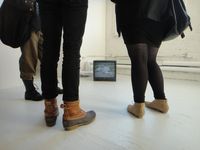 Upstairs at PS1, viewers take in the hype-saturated Laurel Nakadate exhibit.